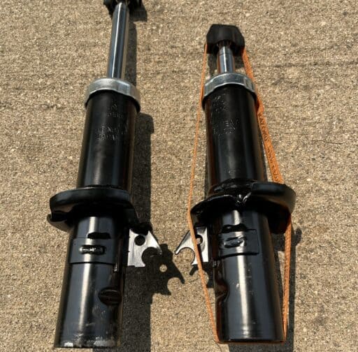 New motorcycle front suspension forks for performance upgrade, installed for improved handling and ride quality. High-quality suspension parts designed for optimal motorcycle performance.