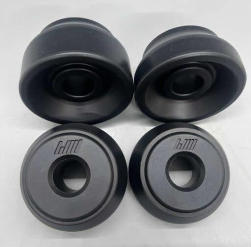 High-performance black car suspension bushings for improved stability and handling, featuring durable rubber components for optimal shock absorption and suspension articulation.