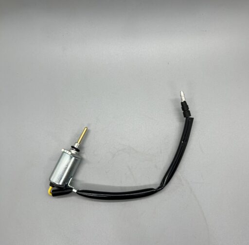 - Small electric motor with attached wiring for automotive performance enhancement.
