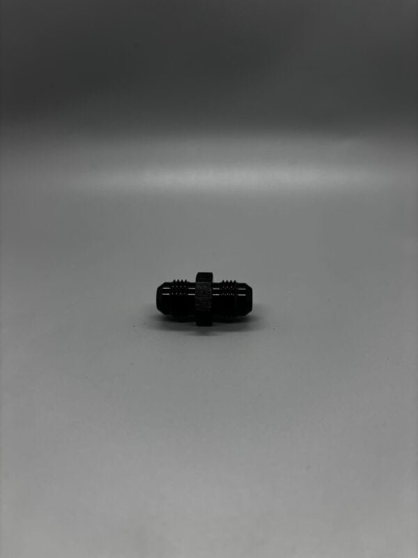 Close-up of a black double screw used in automotive performance upgrades, showcasing precision threading and durable construction.